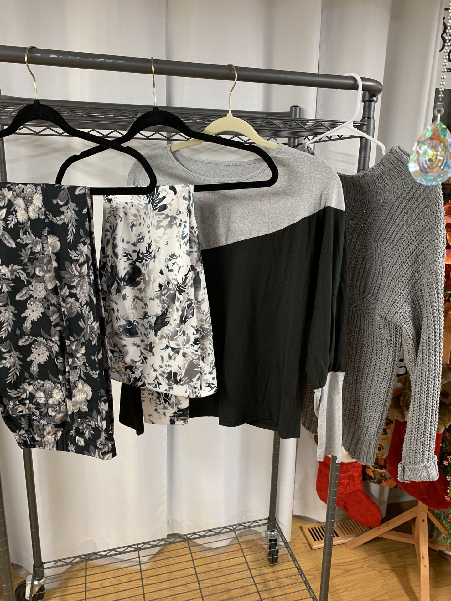 Grey Black And White Set Which Consist Of Black Print Jeans, White And Black Leggings, Black And Grey Top, And Grey Sweater