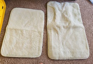 White shower curtain and shower mats
