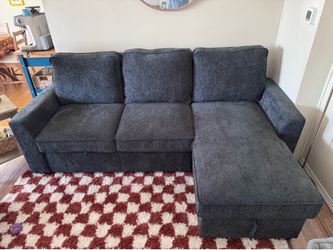 L- shaped sofa with pullout and storage! ONLY USED FOR 5 months!