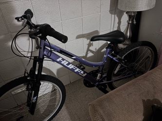 Purple Huffy bicycle