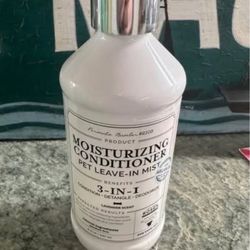 Bottle of dog misting conditioner spray