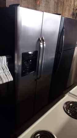 Black and stainless steel Frigidaire double door refrigerator