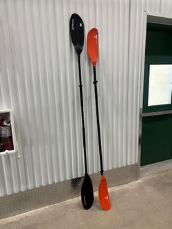 2-piece Tahe kayak paddle featuring orange blades and a black shaft. And Xtreme2  two piece black aluminum kayak paddle.. 96 “ and 92” $80 for both