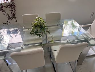 Beautiful modern glass table white chairs