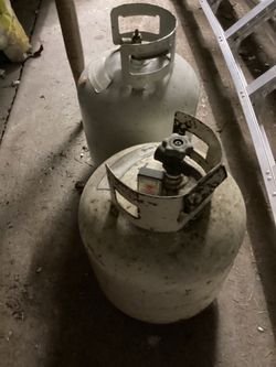 2 5-gallon propane tanks