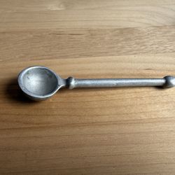 is a vintage pewter tasting spoon used for tasting wine or gourmet food. 