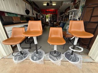 Brand new adjustable height Real leather swivel Bar stools only $110 each