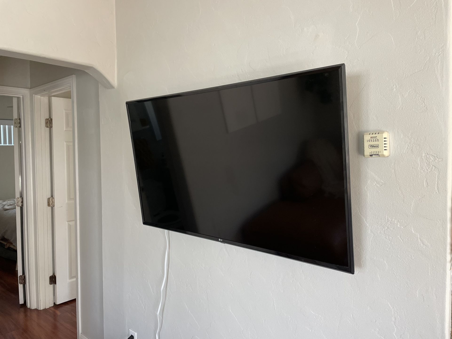 LG TV with Mount And Fire Stick