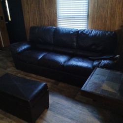 Brown Leather Couch And Ottoman, Area Rug,black Mini Fridge With Freezer, Couple More Household Items Such As Crock Pot, Conventional Oven, Etc
