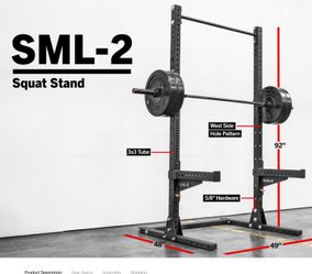 Rogue Squat Rack with barbell, bench, pull up bar, and plates