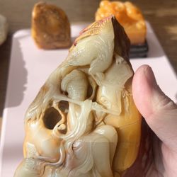 This Chinese Antique Jade stone carving is finely crafted with a smooth, jade-like texture and natural color transitions. It depicts an elegant lady p