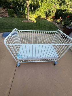 Portable crib!! Super useful for Grandma’s  or sitter’s house  - or wherever you need a second crib ! Solid and sturdy metal, thick mattress in perfec
