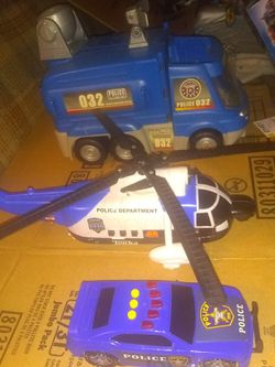 3 different cops vehicles (car, a mobile jail , and a Tonka chopper)
