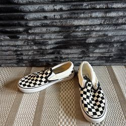 Black and white checkered Vans slip-on shoes size 5.5W