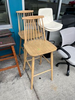 Tall light wood counter or bar stools (in store)