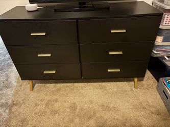 Black dresser, gold accents