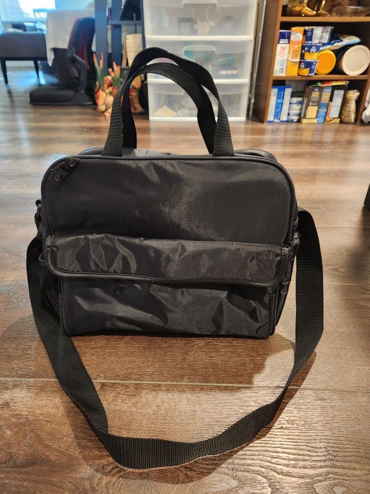 Black Similac diaper bag. Side pouch, front and side pockets.13x11x6 inch, Clean and  good condition 