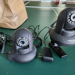 Used Foscam wireless outdoor cameras w/2-way audio & night vision.