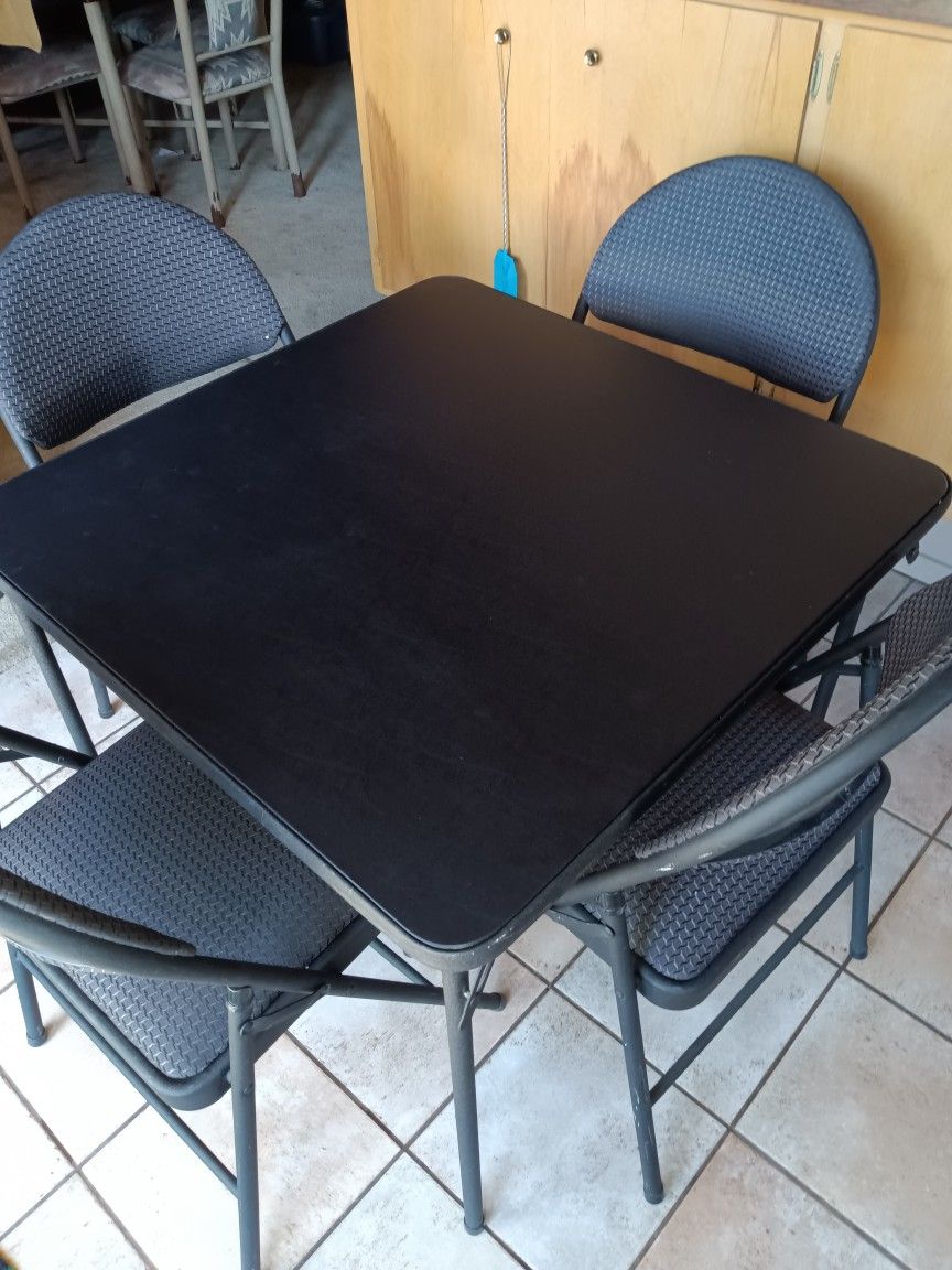 Folding Table And 4 Folding Chairs.