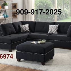 BLACK OR GREY SECTIONAL WITH REVERSIBLE CHAISE. OTTOMAN INCLUDED 
