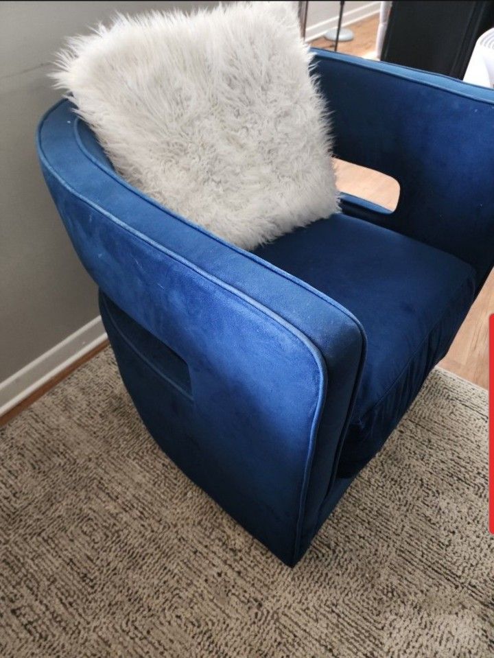 Blue Suede Swivel Chair With White Pillow