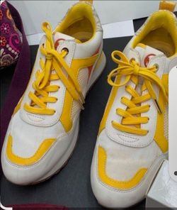Michael Kors Colorblock Logo Lace Up Low Top Sneakers in a vibrant yellow, white, and  gold