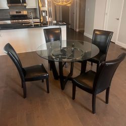 Glass Top Table With 4 Black Leather Chairs