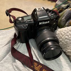 Nikon N90. And Nikon DX 18 X 55