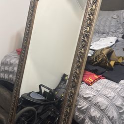 Mirror with gold trim