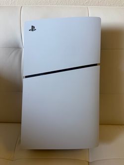 Ps5 with 2 controllers (white and purple).