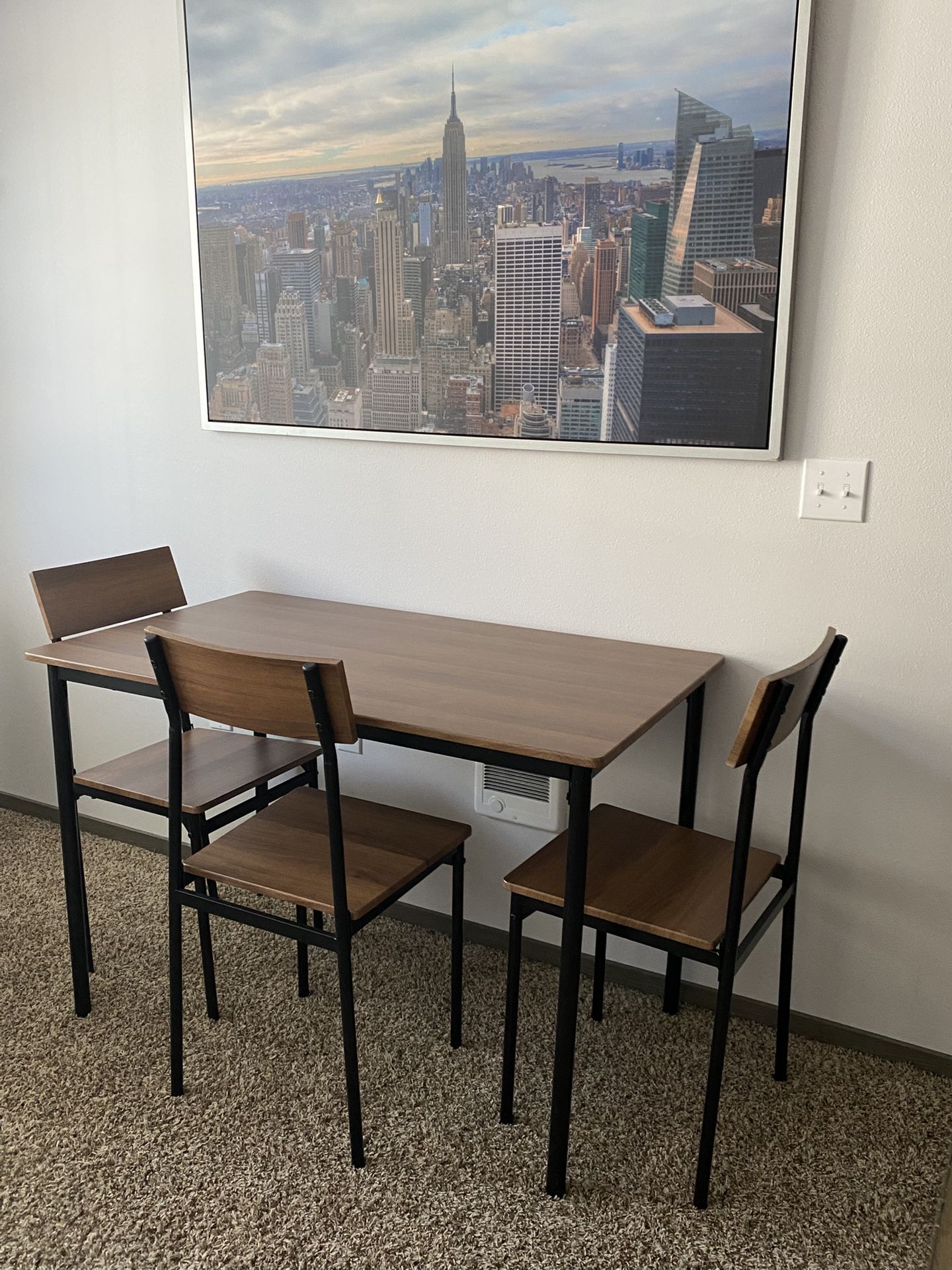 table with three chairs