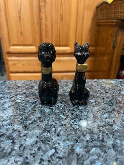 Vintage Black Red-ware Long Tall Cat and Dog pair of salt and pepper shakers.  Size approximately 3 1/2 inches tall.  Preowned minor paint wear on the