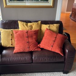 West Elm decorative pillows. Gold and burnt orange colors. 