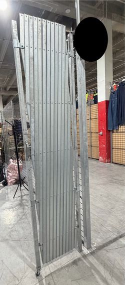 Galvanized metal accordion-style door