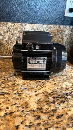This is a EMG Elettromeccanica electric motor, commonly used in water pumps or spa applications