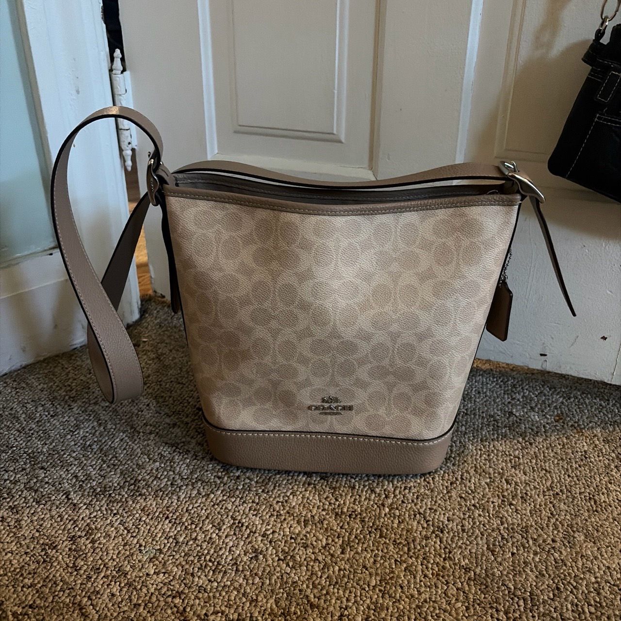 Tan and Cream Coach Canvas Jude Duffel bag.