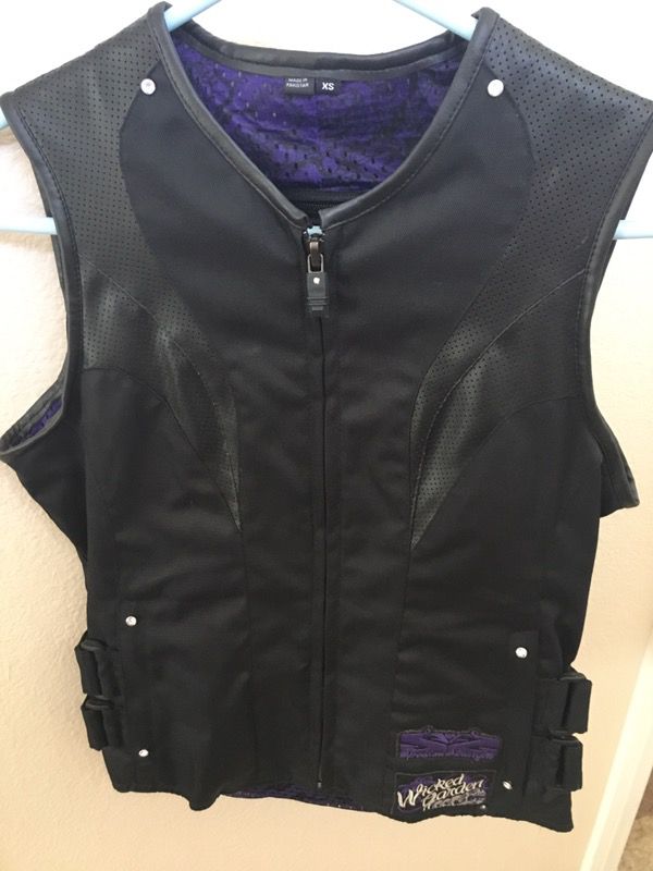 Woman's speed and strength motorcycle vest with Swarovski crystals