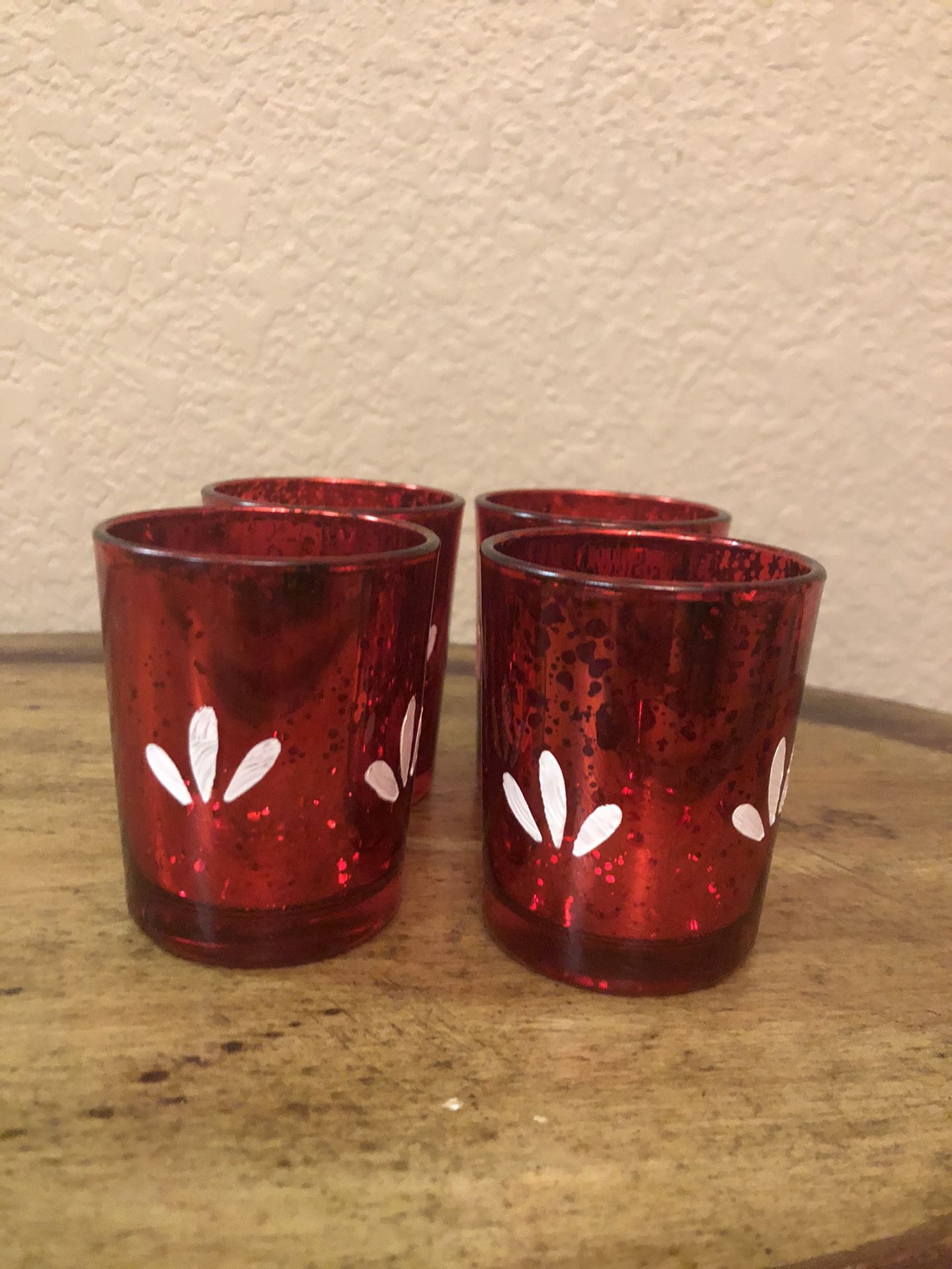 Red candle holders with white flower painting