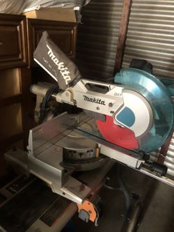 Makita 12 inch compound miter saw with stands.