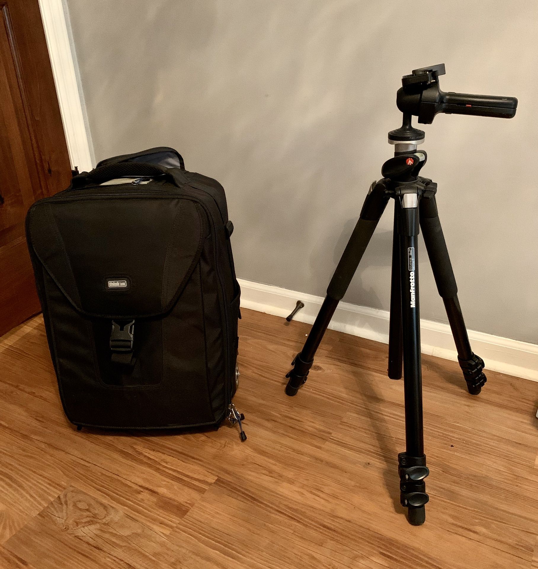 Manfrotto Tripod, Grip, and Think Tank Airport Security Rolling Camera Bag
