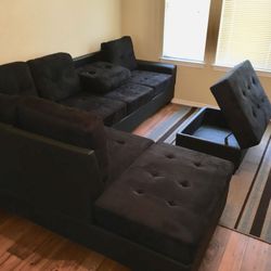 Black on black sectional with free ottoman