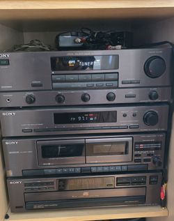 Stacked Sony Stereo System and Bose Speakers