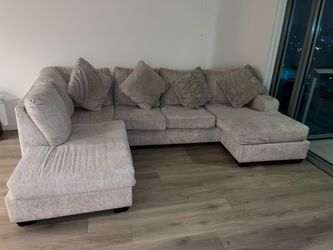 Sectional Sofa  Light Beige Color With Pillows  By Ashley Furniture