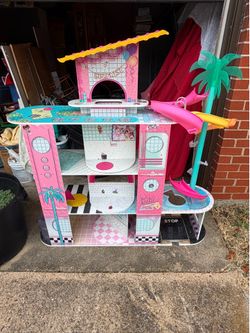 DOLL HOUSE. 48"w x 12"deep x 50 1/2"high; cross streets are Arapaho & Waterview