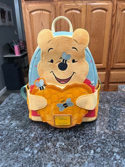 Loungefly Disney Winnie the Pooh Honey Heart Honey Mini Backpack.  Brand New with tag.  Smoke free home