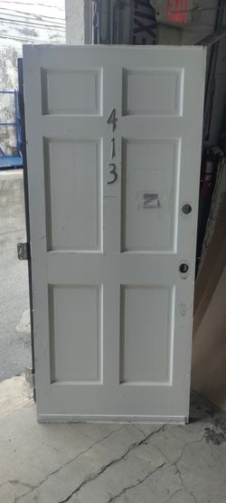 Exterior wood door left hand in swing or could be a right hand out swing approximately 35.25x80