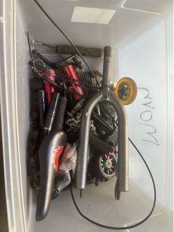 Box of bike parts and scooter parts