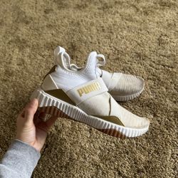 White and gold Puma athletic, slip on shoes; excellent condition, just need a deep clean