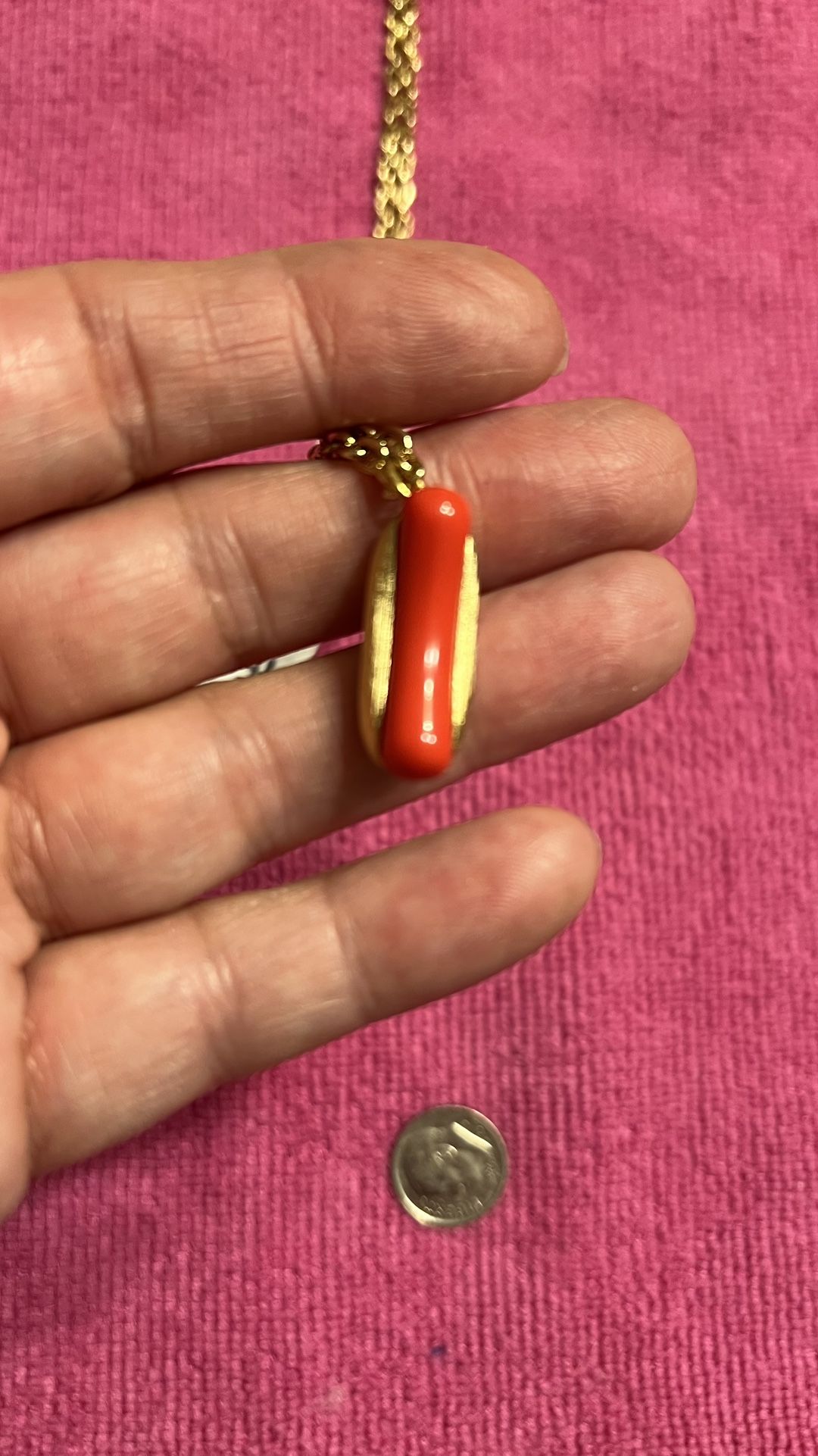Avon Rare Vintage Put on the Dog Pendant Necklace Gold Tone Bun With Plastic Red Hot Dog . New Never Been Used