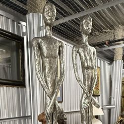 PAIR OF SEVEN FOOT TALL SILVER BRUTALIST ABSTRACT STATUES